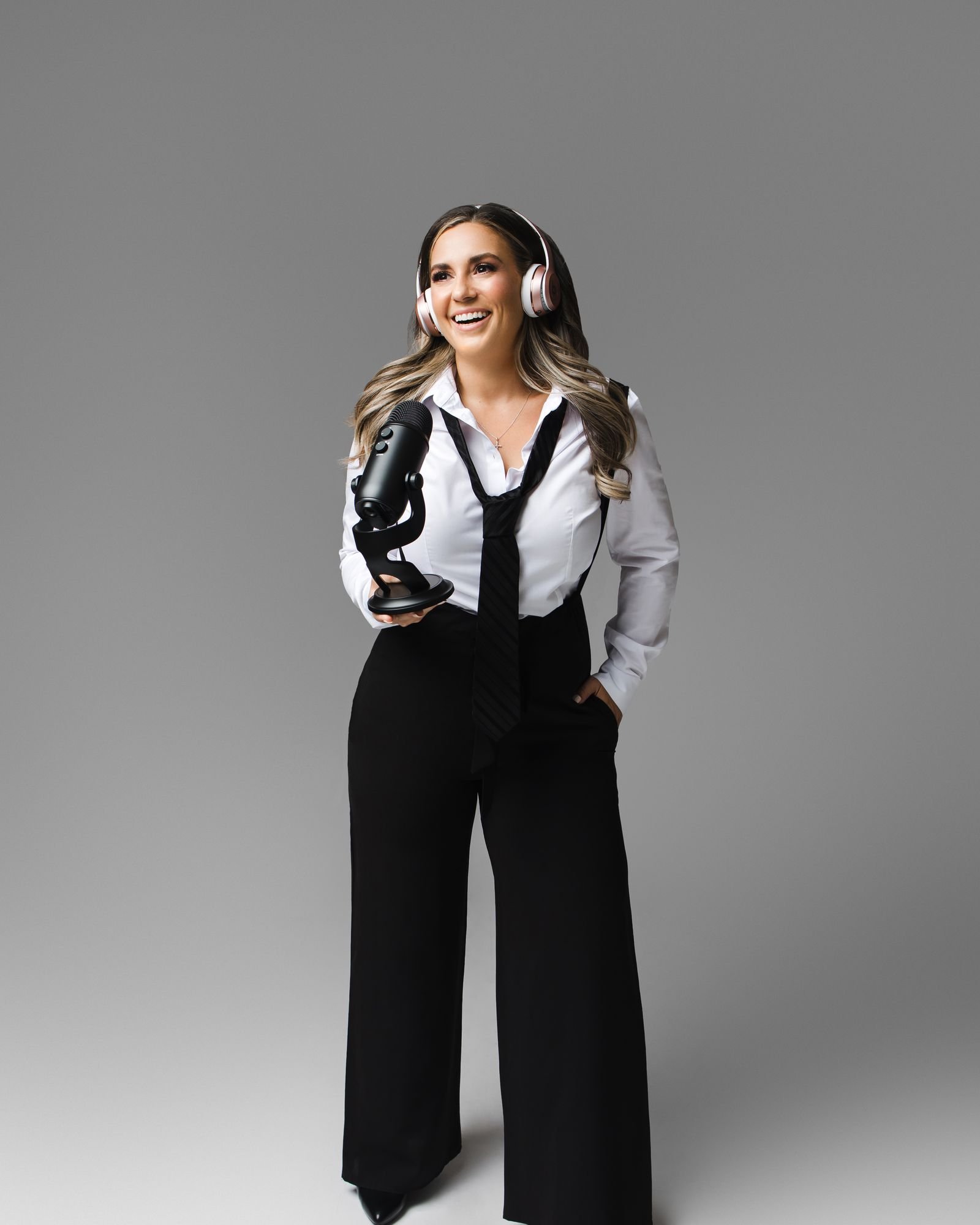 Jessica Pickles standing beside a studio microphone